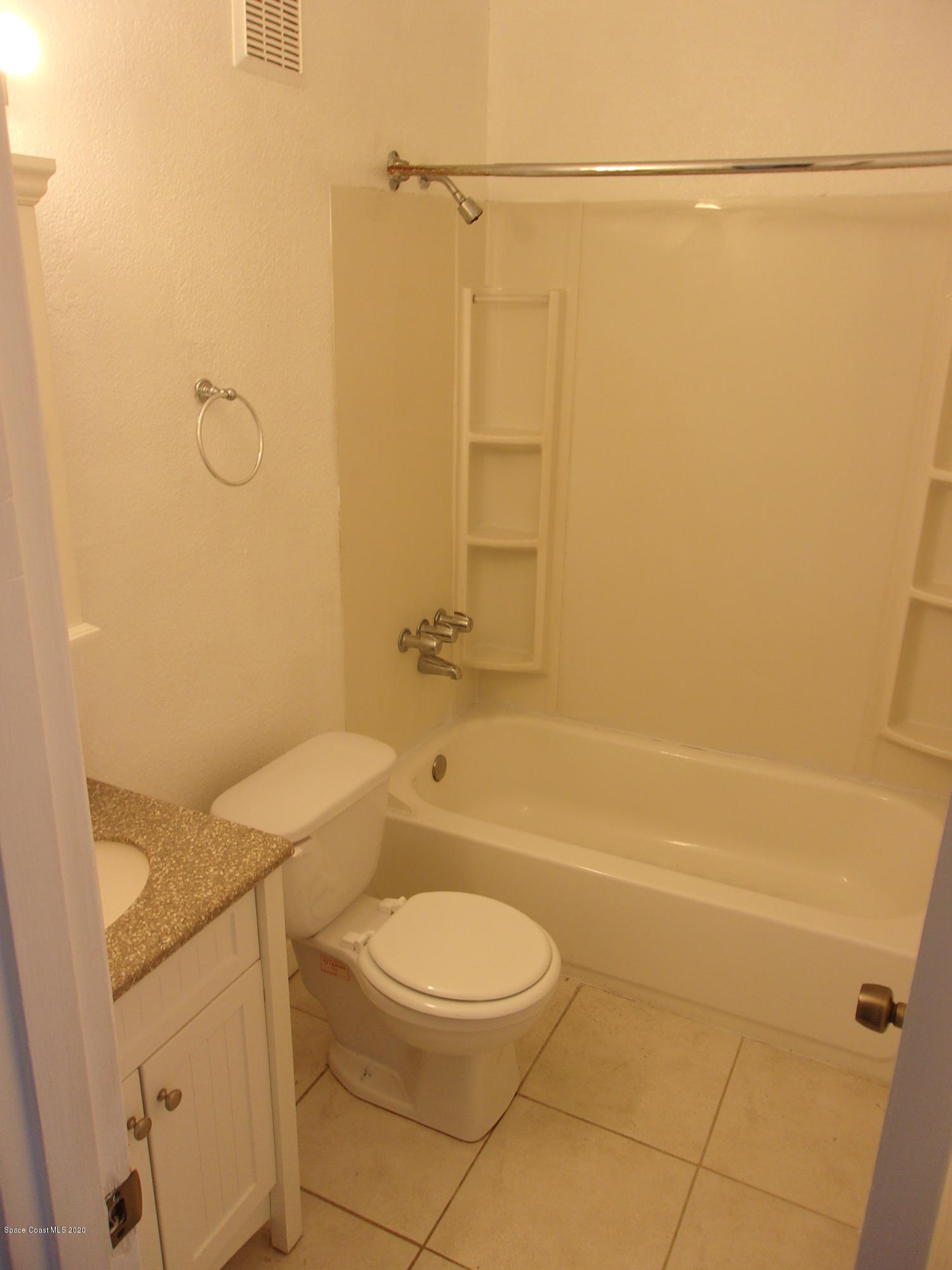 1711 Dixon Boulevard, Unit 242 Cocoa, FL 32922 - Photo 25 of 26 a bathroom with a toilet and a shower