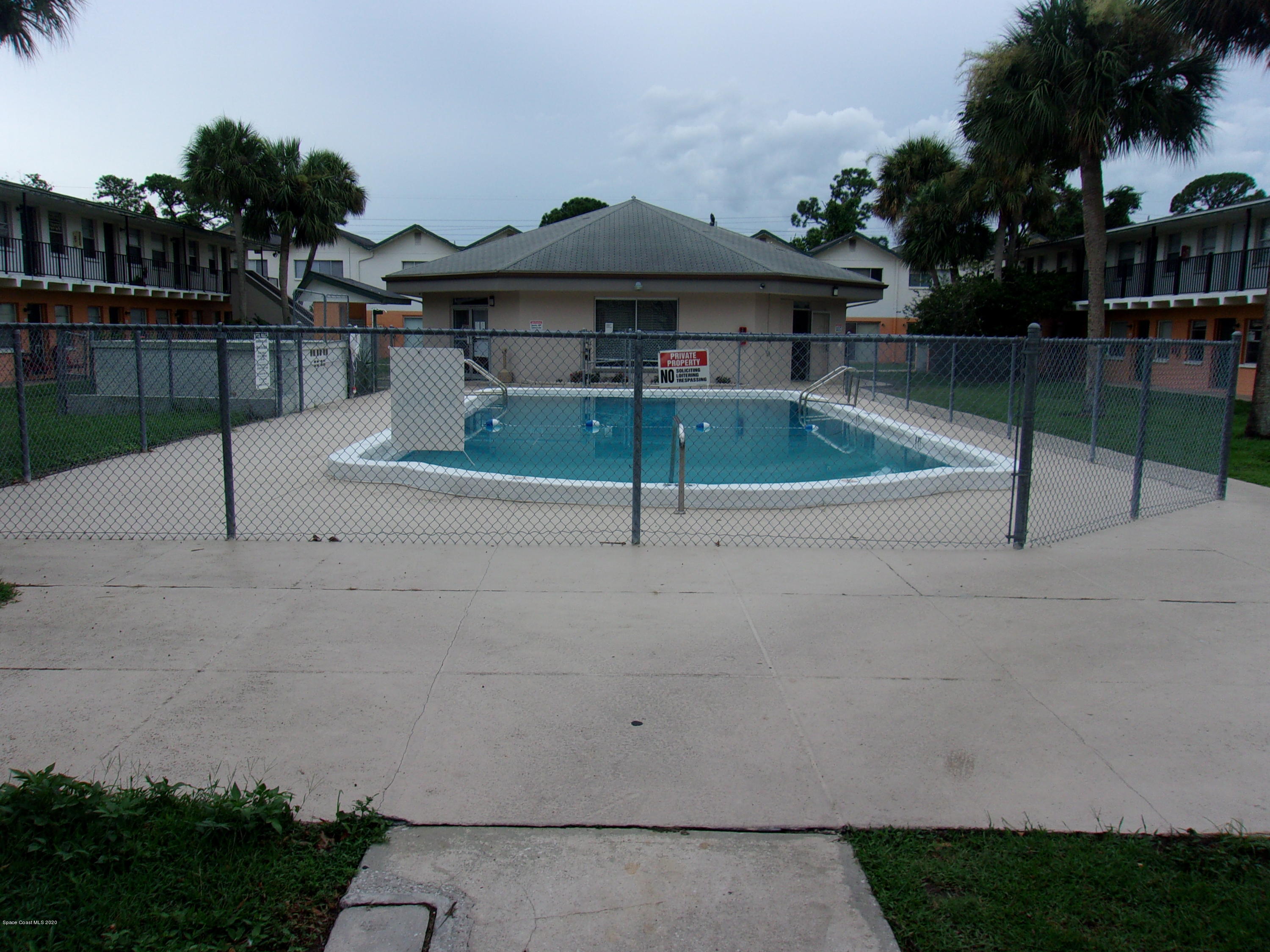 1711 Dixon Boulevard, Unit 242 Cocoa, FL 32922 - Photo 3 of 26 a patio with table and chairs