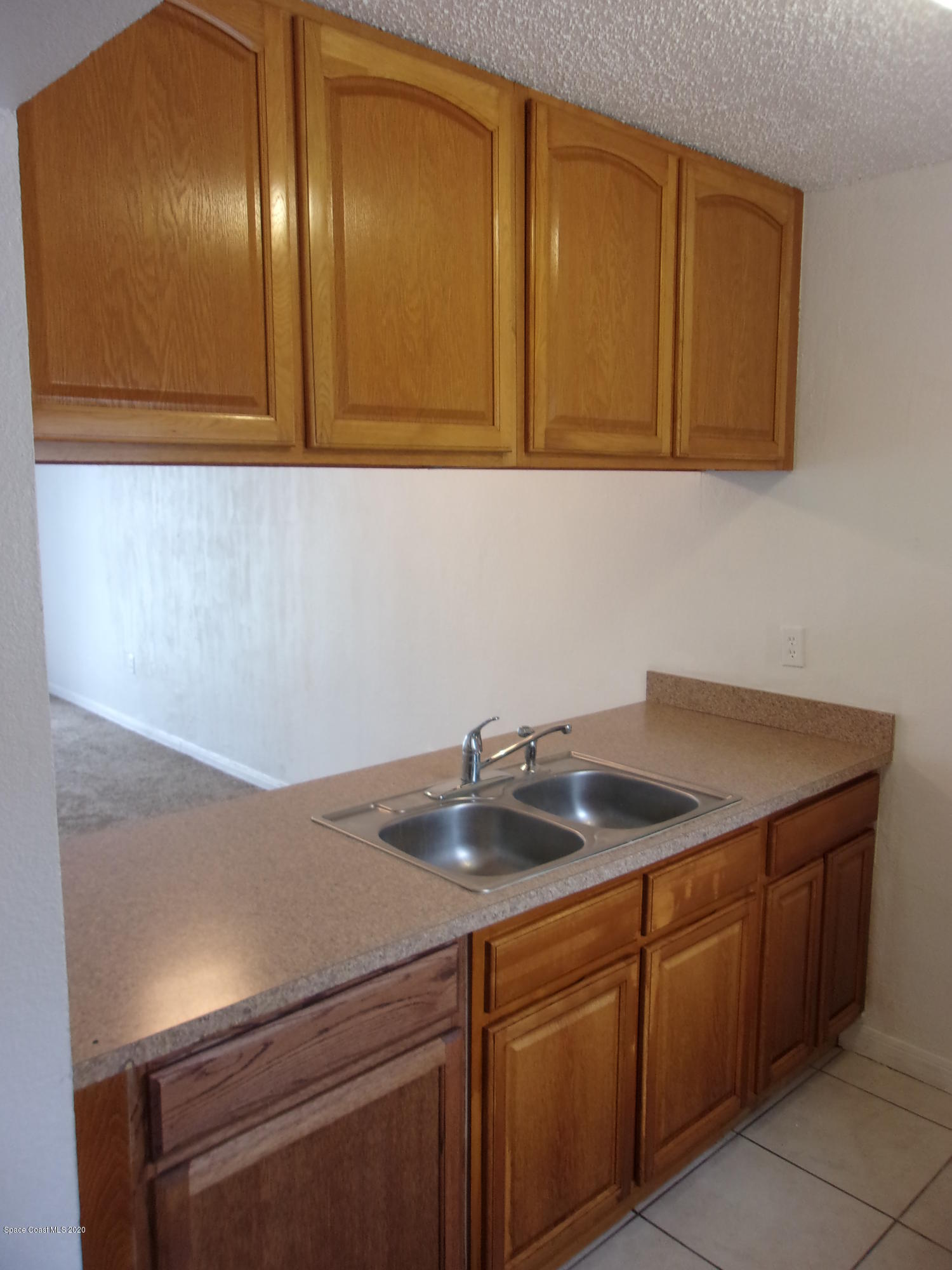 1711 Dixon Boulevard, Unit 242 Cocoa, FL 32922 - Photo 9 of 26 a kitchen with a sink and cabinets
