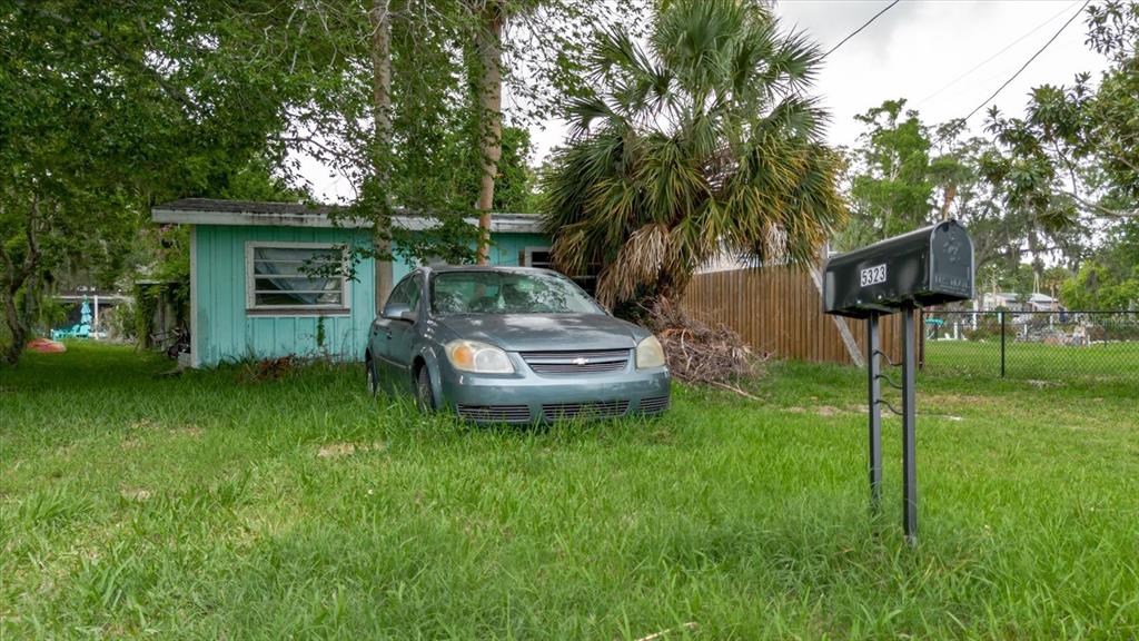 5323 Circle Drive Weeki Wachee, FL 34607 - Photo 77 of 77 a front view of a house with garden