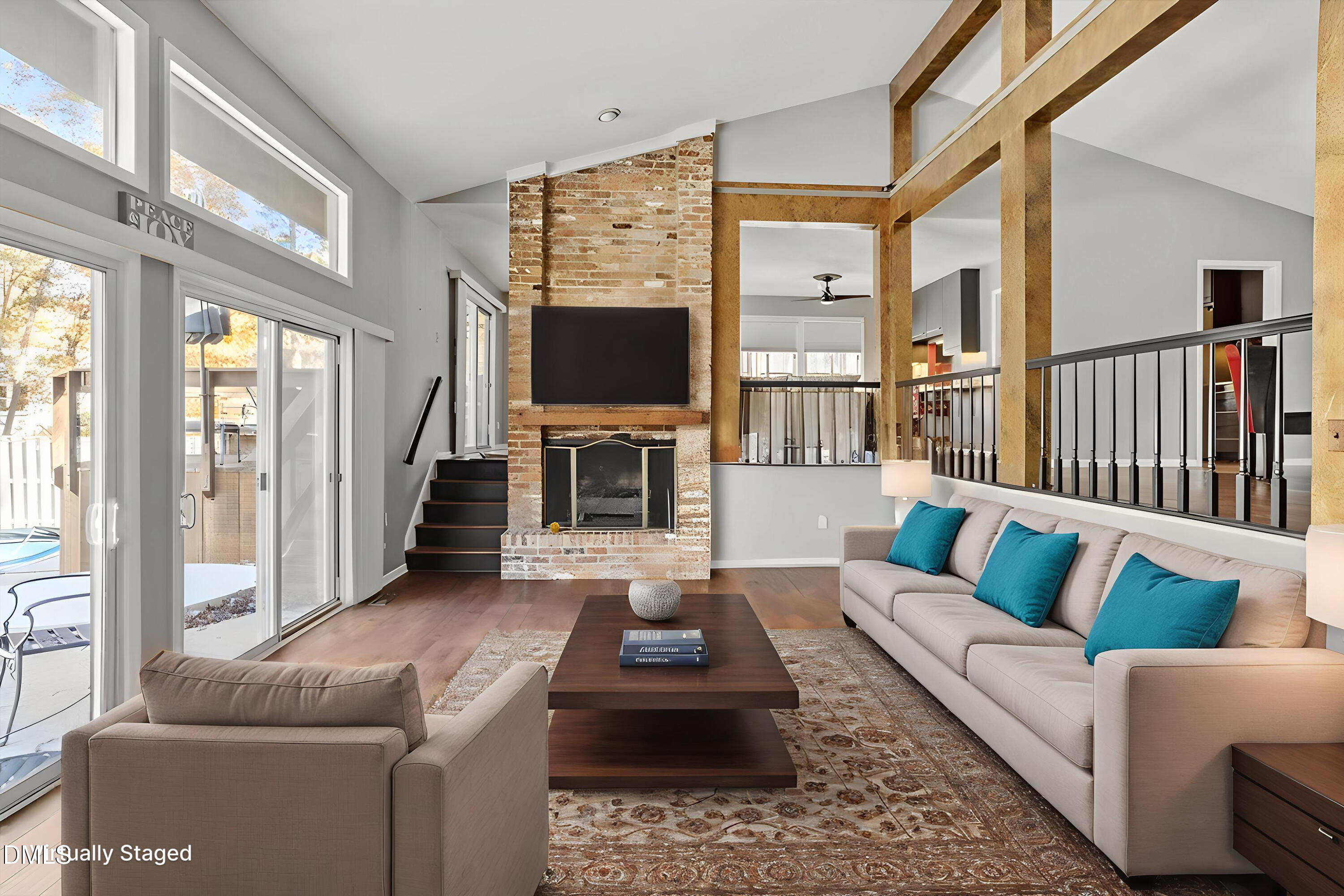 4501 Wingate Drive Raleigh, NC 27609 - Photo 14 of 36 a living room with furniture a flat screen tv and a large window