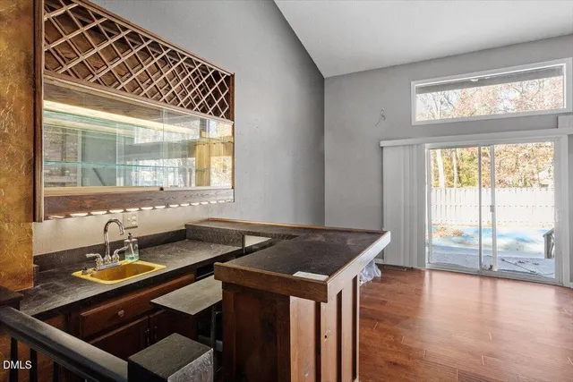 a kitchen that has a sink and a stove