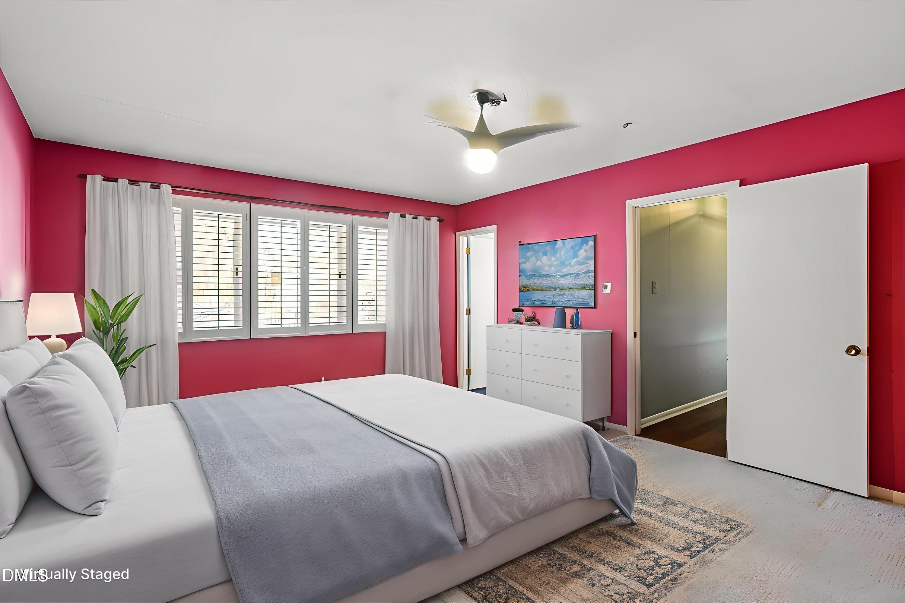 4501 Wingate Drive Raleigh, NC 27609 - Photo 20 of 36 a bedroom with a bed and a large window