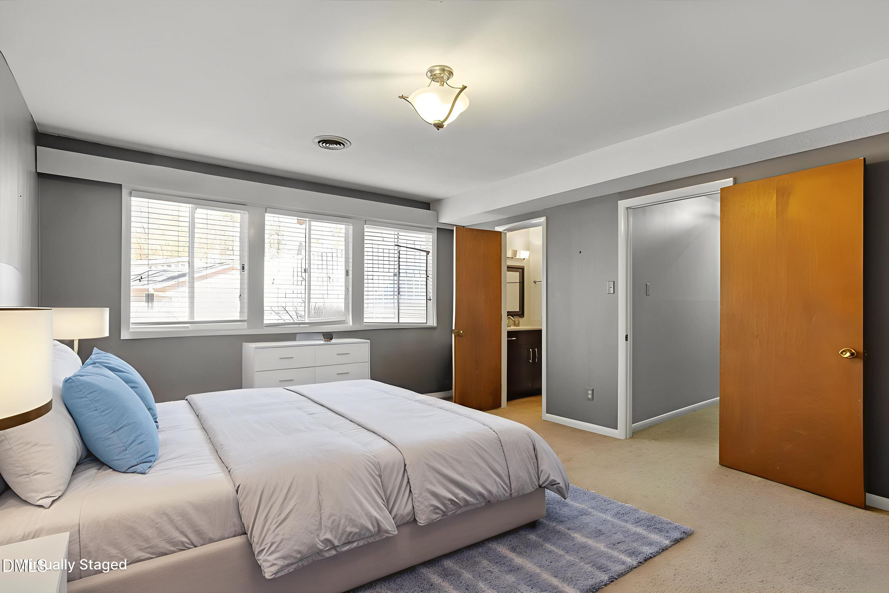4501 Wingate Drive Raleigh, NC 27609 - Photo 26 of 36 a bedroom with a large bed and a window
