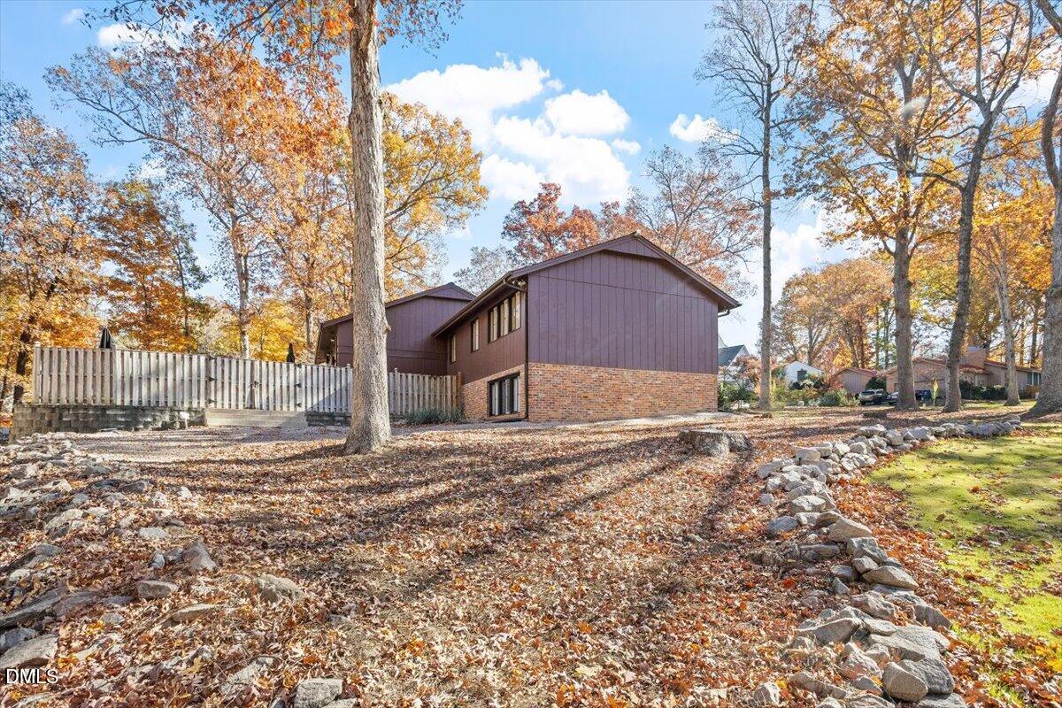 4501 Wingate Drive Raleigh, NC 27609 - Photo 32 of 36 a view of a house with a yard covered in snow