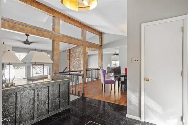 a view of a dining room with furniture wooden floor and a chandelier