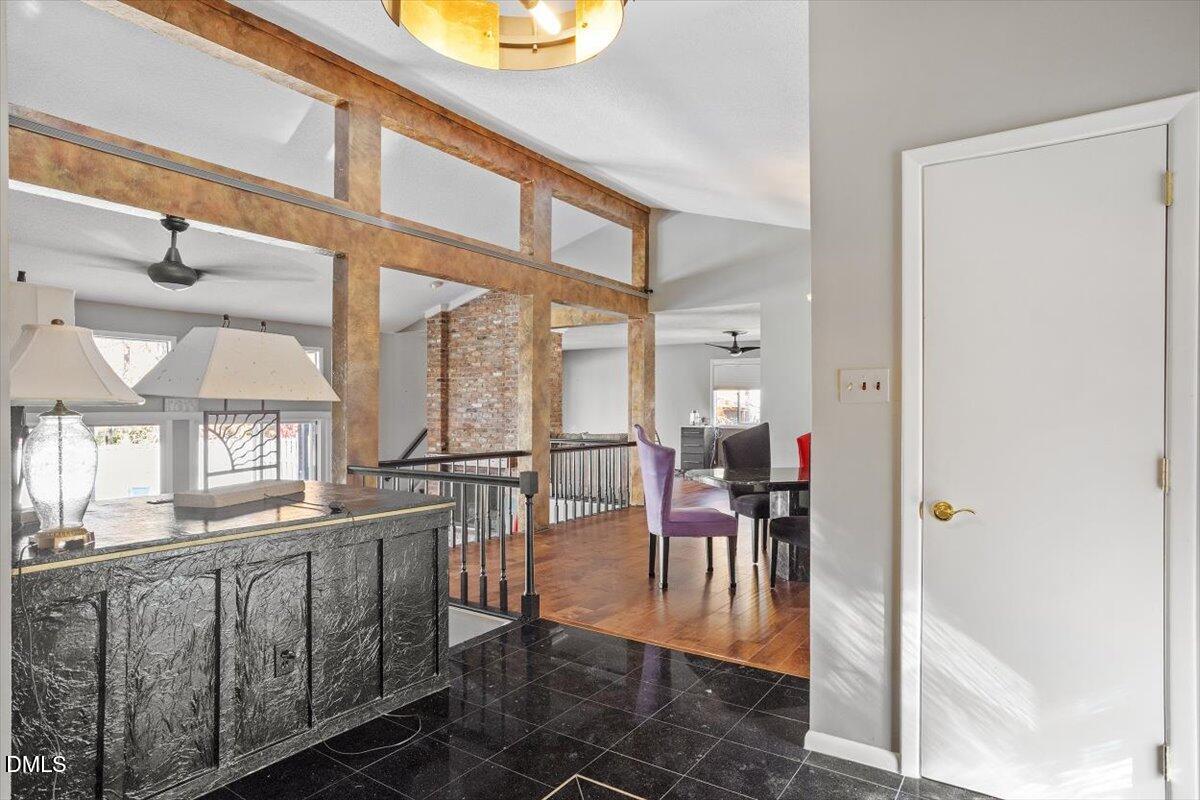 4501 Wingate Drive Raleigh, NC 27609 - Photo 5 of 36 a view of a dining room with furniture wooden floor and a chandelier