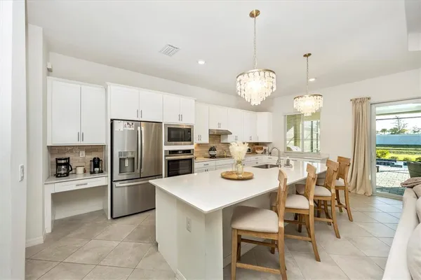 a living room with furniture white walls and white walls