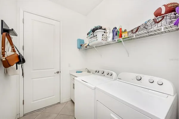 a bathroom with a sink a toilet a mirror and shower curtain