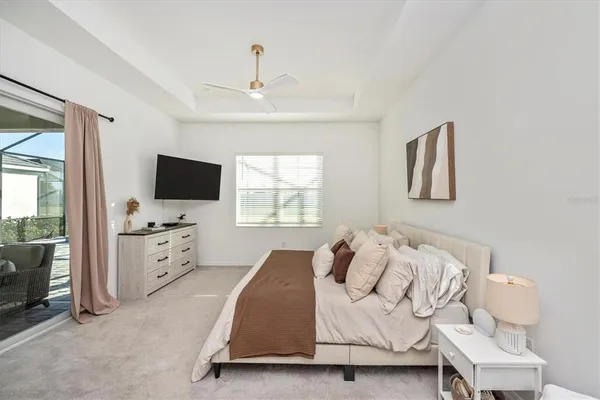 a living room with a floor to ceiling window and a table