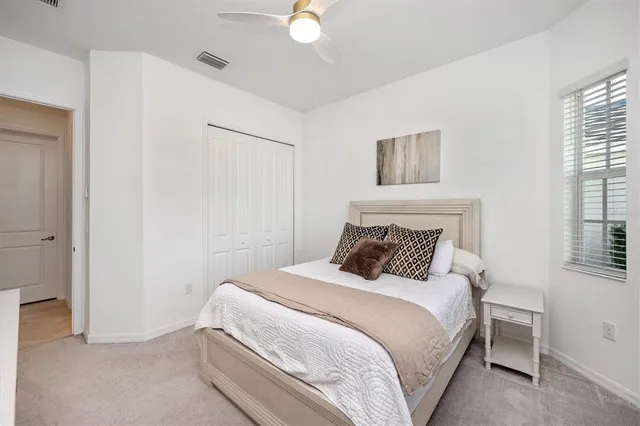 a building outdoor space with patio furniture and potted plants