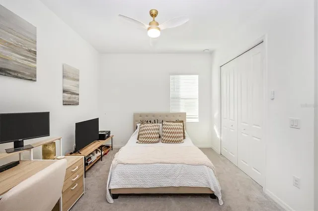 a swimming pool view with a seating space and a garden view