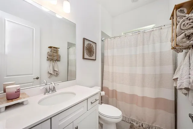 a view of a room with gym equipment and a large window