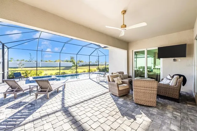 a view of a patio with a table and chairs