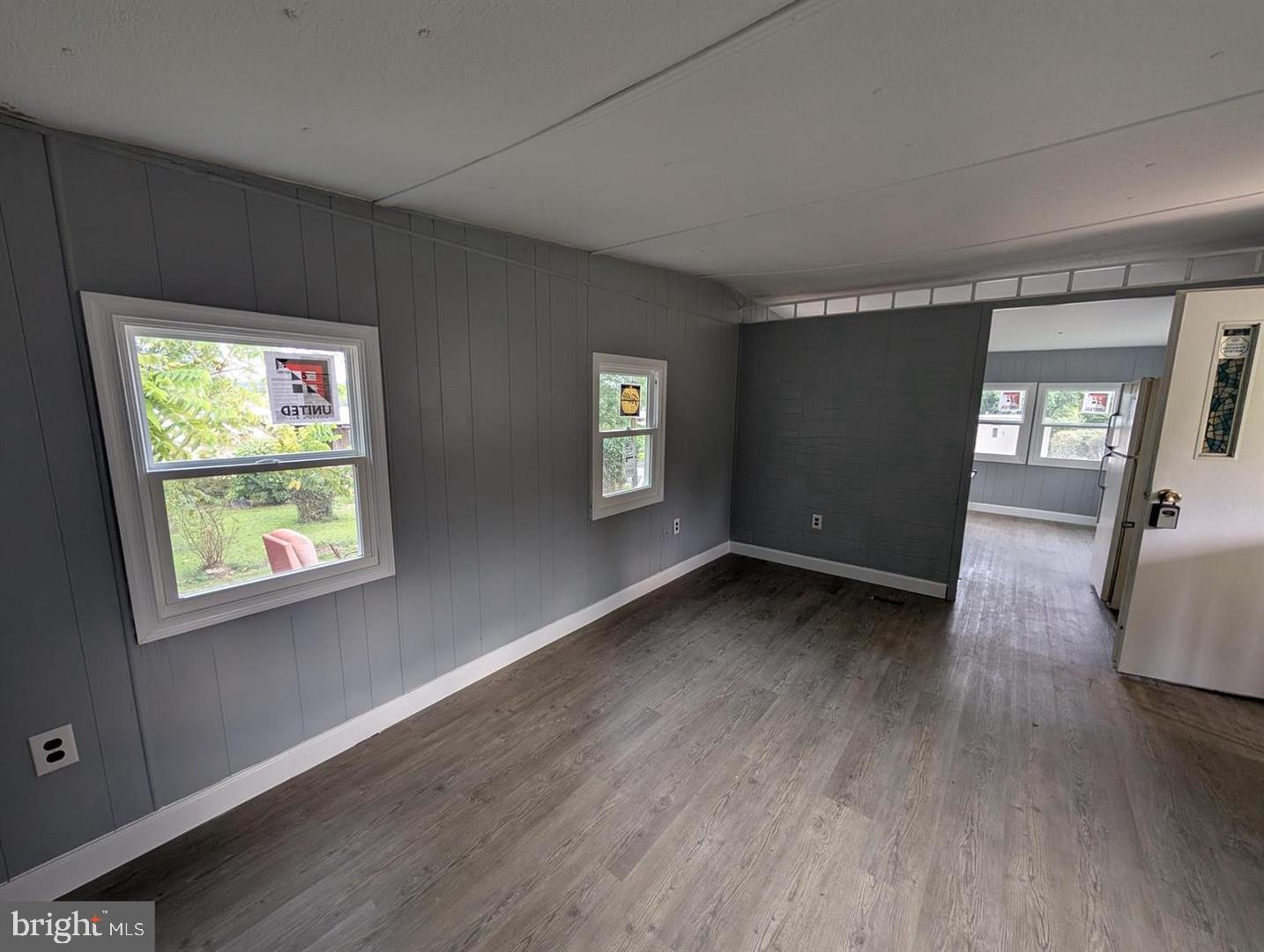 125 Santilli Road Landenberg, PA 19350 - Photo 4 of 7 a view of an empty room with wooden floor and a window