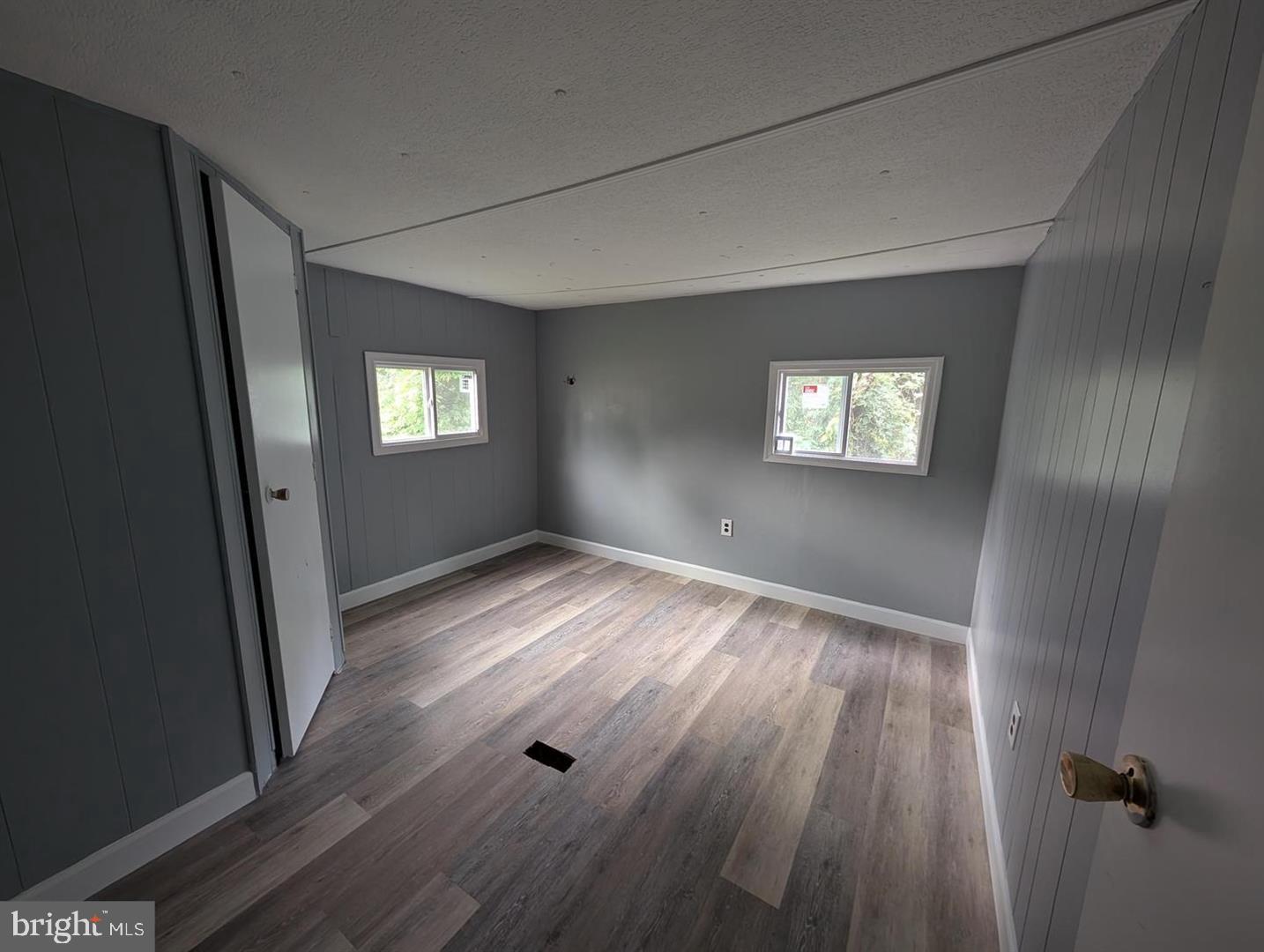 125 Santilli Road Landenberg, PA 19350 - Photo 5 of 7 wooden floor in an empty room with a window