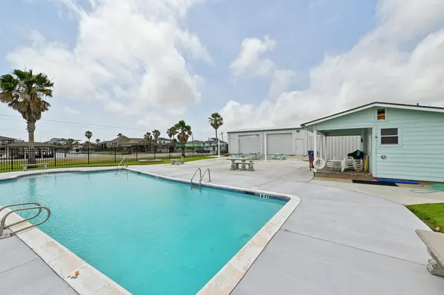 a view of a hallway with a livingroom and entryway