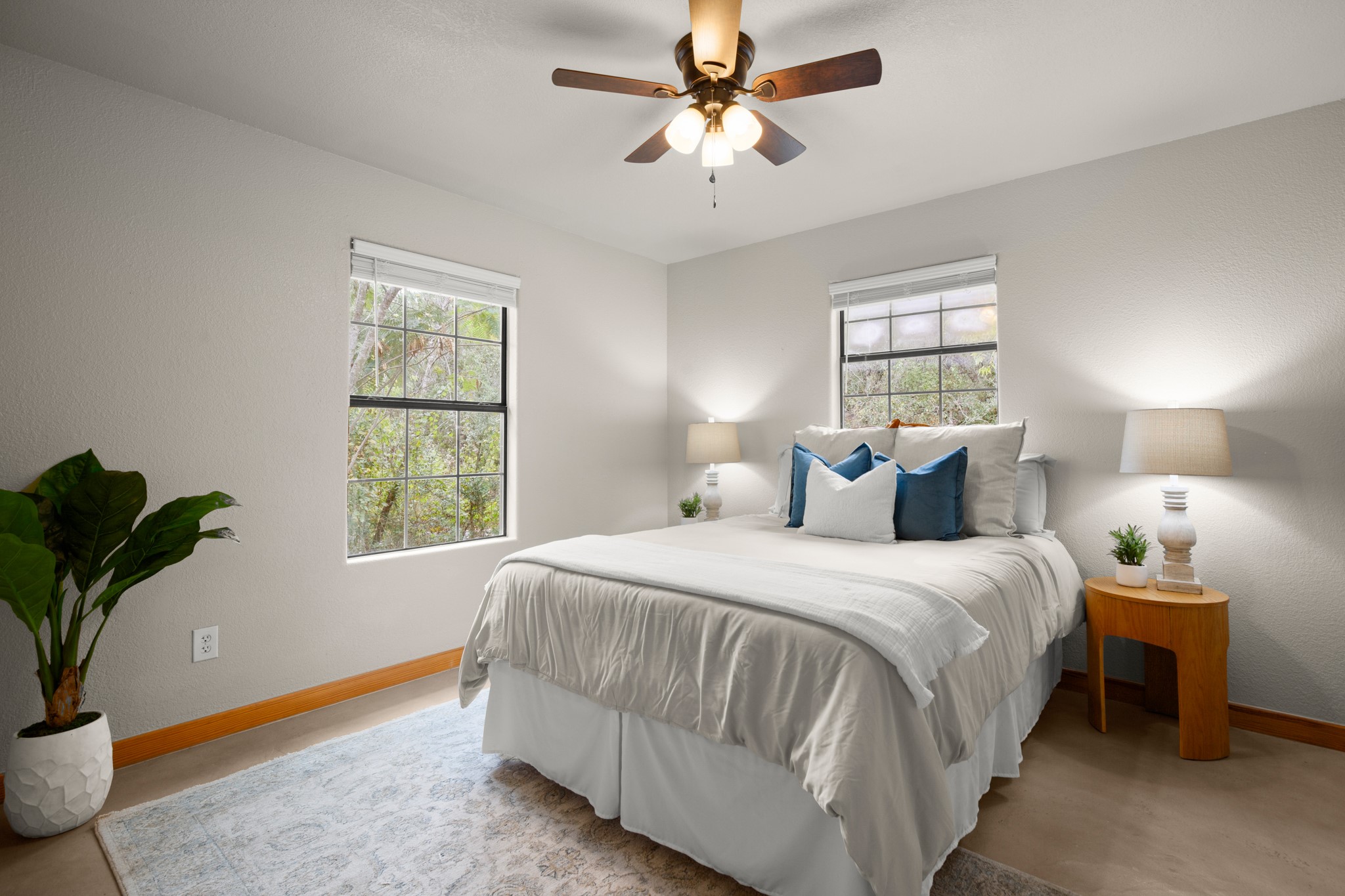 235 Smith Creek Road Wimberley, TX 78676 - Photo 15 of 40 a bedroom with bed and window