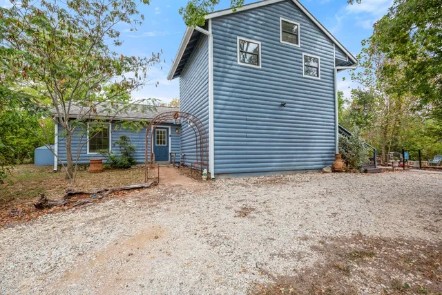 a view of a backyard with a patio