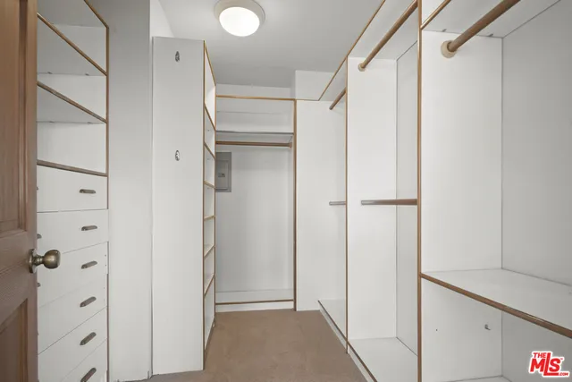 a bathroom with a sink a mirror and a shower