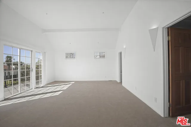 a view of empty room with windows