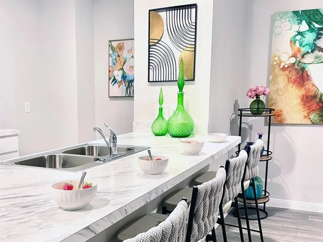a view of a dining room with furniture and window