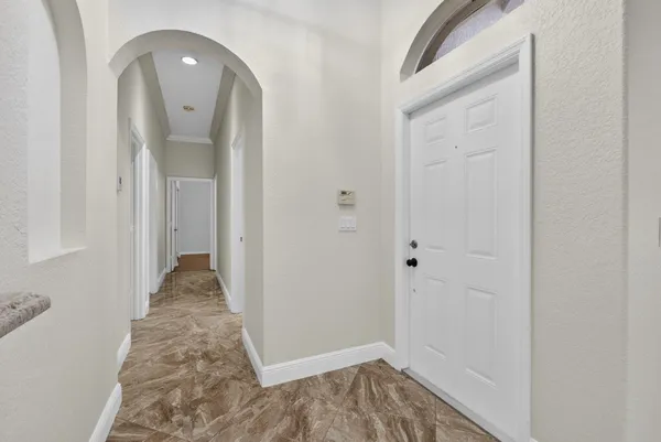 a view of a kitchen with a refrigerator and a sink