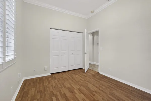 a view of a livingroom with a ceiling fan and window