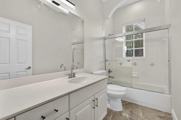 a view of an empty room with windows