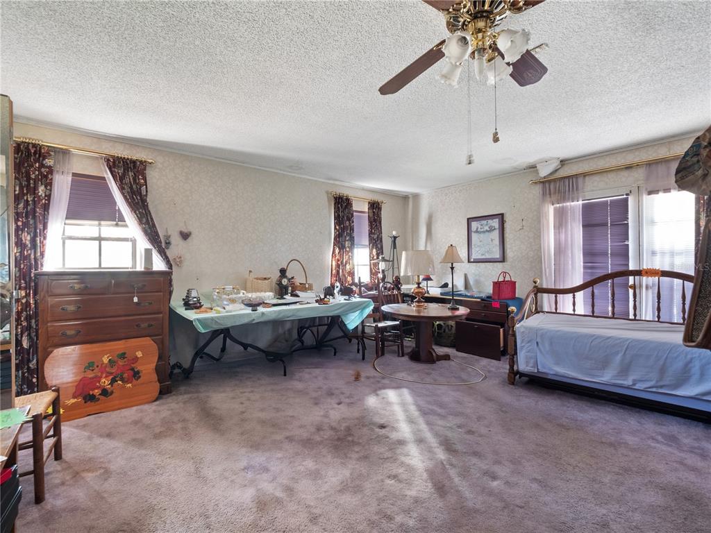 6604 Mt Plymouth Road Apopka, FL 32712 - Photo 12 of 31 a living room with furniture and a window