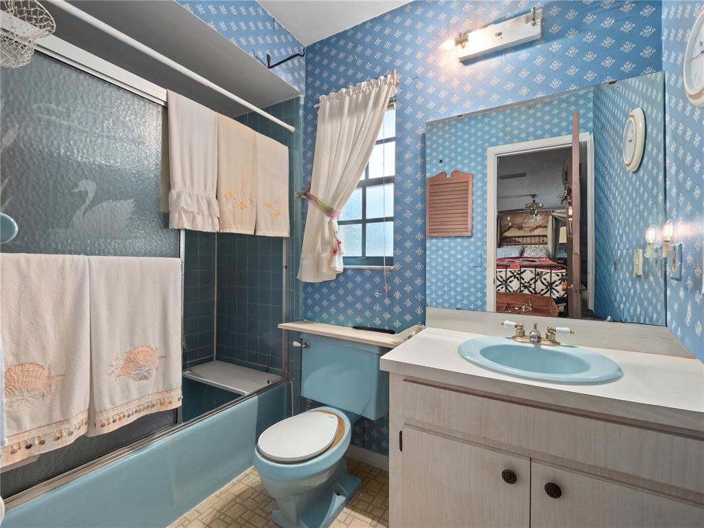 6604 Mt Plymouth Road Apopka, FL 32712 - Photo 13 of 31 a bathroom with a sink toilet and mirror