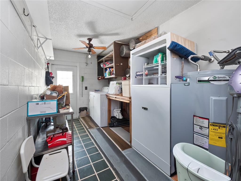 6604 Mt Plymouth Road Apopka, FL 32712 - Photo 18 of 31 a utility room with cabinets