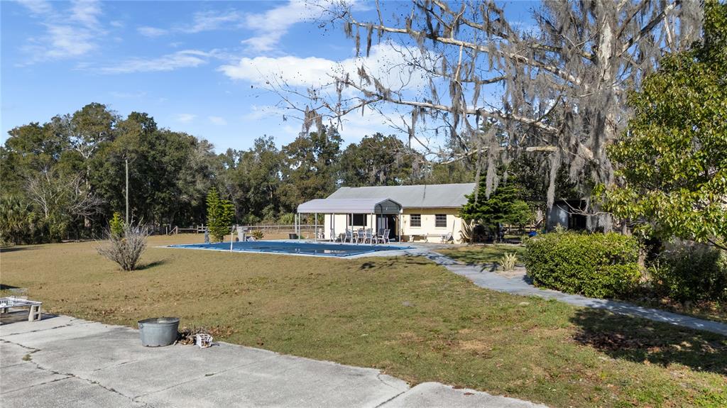 6604 Mt Plymouth Road Apopka, FL 32712 - Photo 26 of 31 a view of a house with a snow on the road