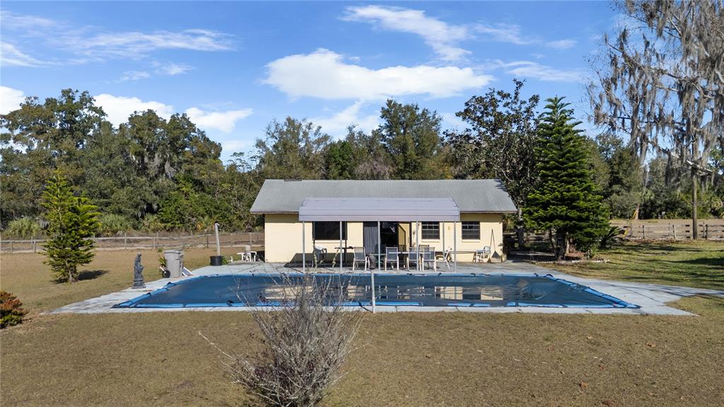6604 Mt Plymouth Road Apopka, FL 32712 - Photo 27 of 31 a front view of a house with yard patio and fire pit