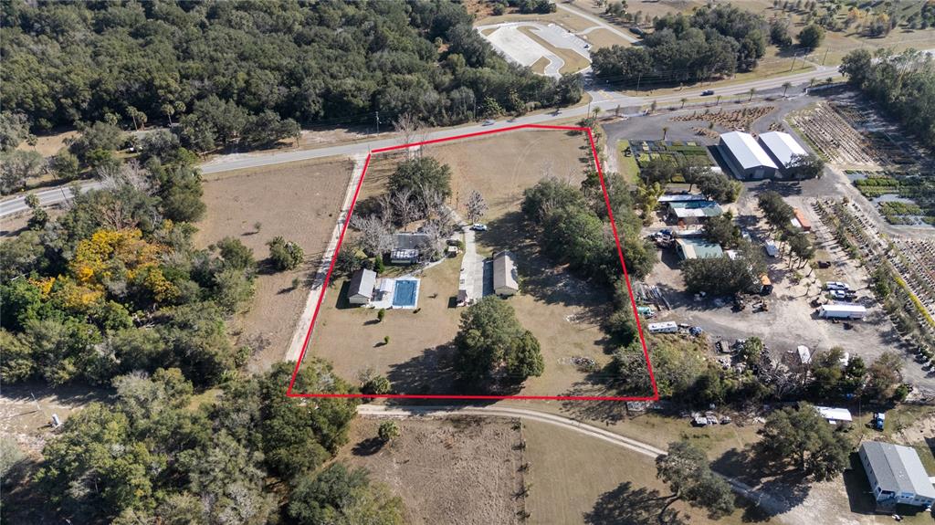 6604 Mt Plymouth Road Apopka, FL 32712 - Photo 4 of 31 an aerial view of residential house with outdoor space