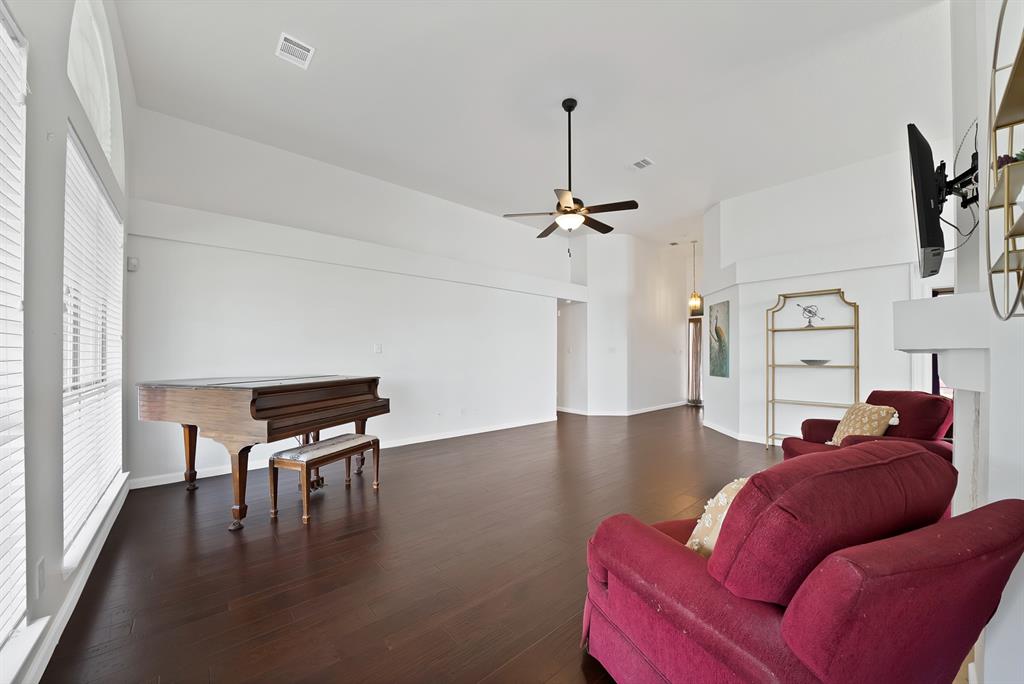 5418 Highgate Lane Rowlett, TX 75088 - Photo 12 of 36 a living room with furniture and a wooden floor