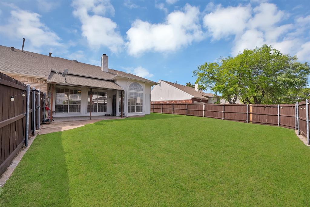 5418 Highgate Lane Rowlett, TX 75088 - Photo 28 of 36 a view of a house with backyard and porch