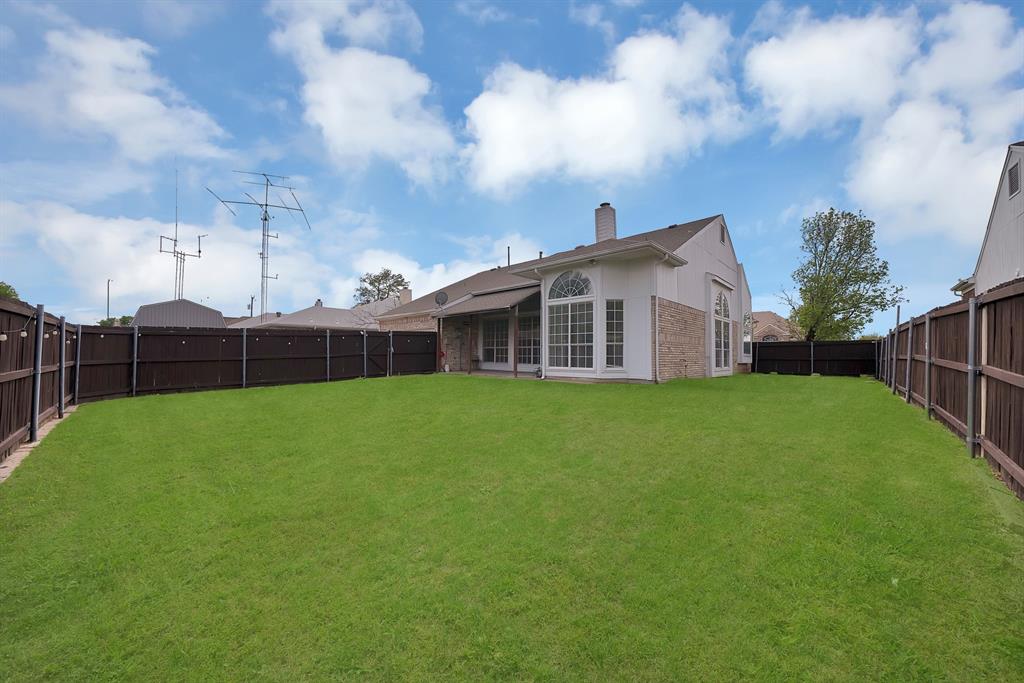 5418 Highgate Lane Rowlett, TX 75088 - Photo 29 of 36 a view of a house with backyard and porch