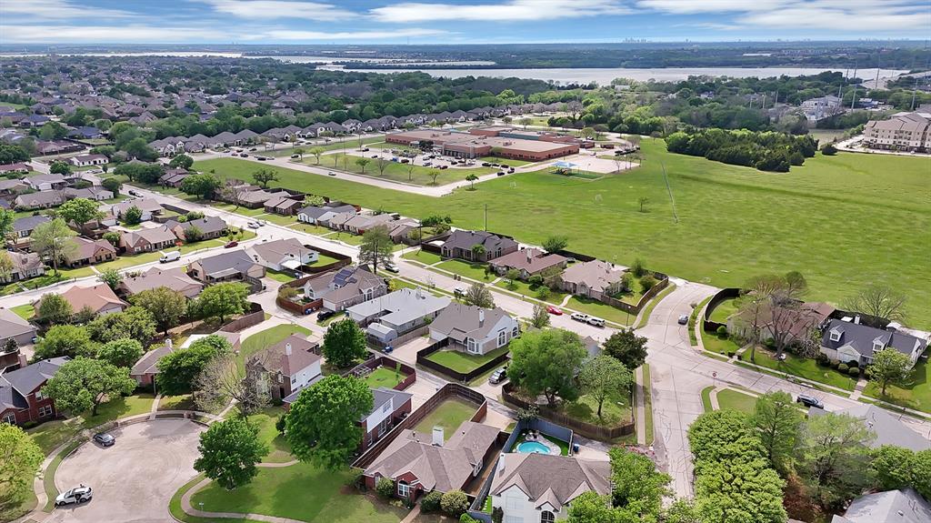5418 Highgate Lane Rowlett, TX 75088 - Photo 35 of 36 an aerial view of a city with lots of residential buildings ocean and mountain view in back