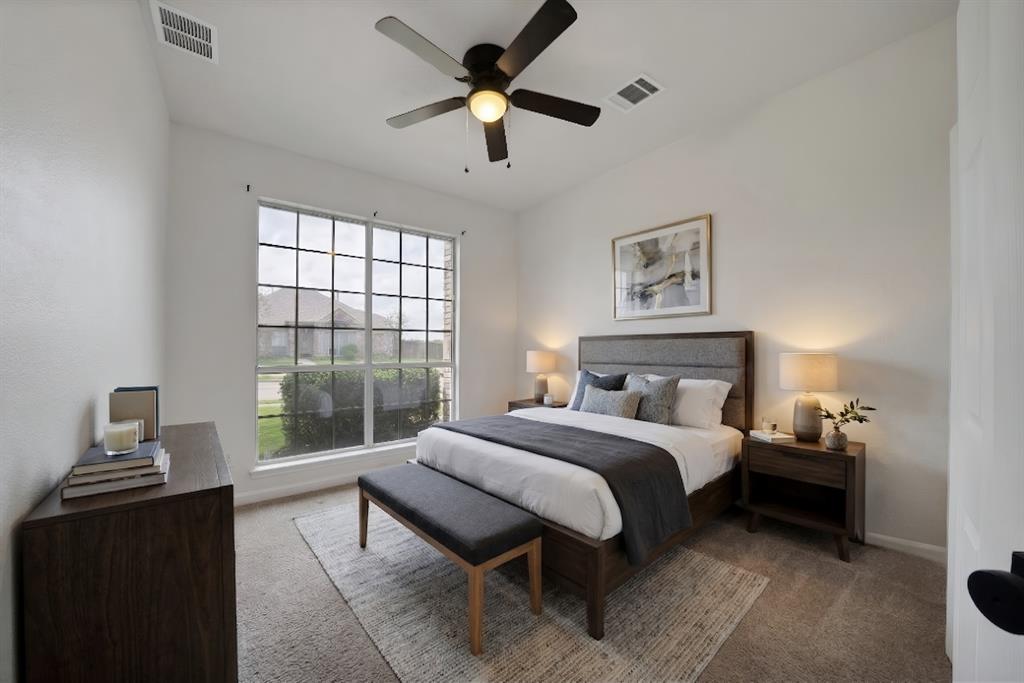 5418 Highgate Lane Rowlett, TX 75088 - Photo 4 of 36 a spacious bedroom with a bed and a window