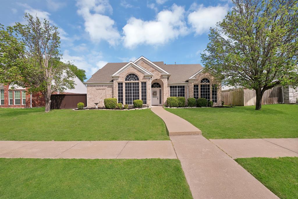 5418 Highgate Lane Rowlett, TX 75088 - Photo 6 of 36 a front view of a house with a yard