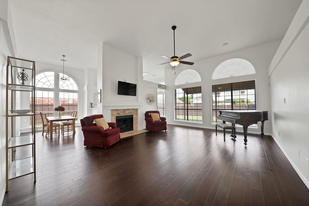 5418 Highgate Lane Rowlett, TX 75088 - Photo 10 of 36 a view of a livingroom with furniture window and wooden floor