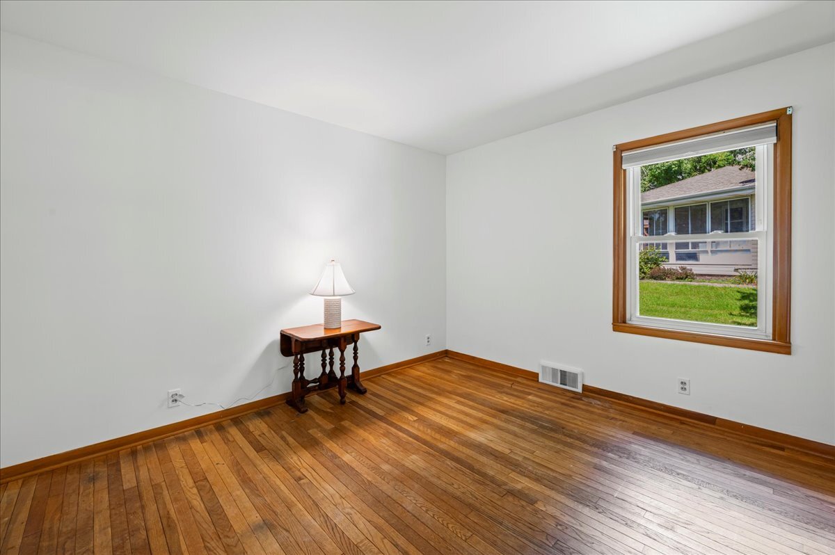 4615 Blue Jay Road Harvard, IL 60033 - Photo 14 of 30 a bedroom with a bed and a window