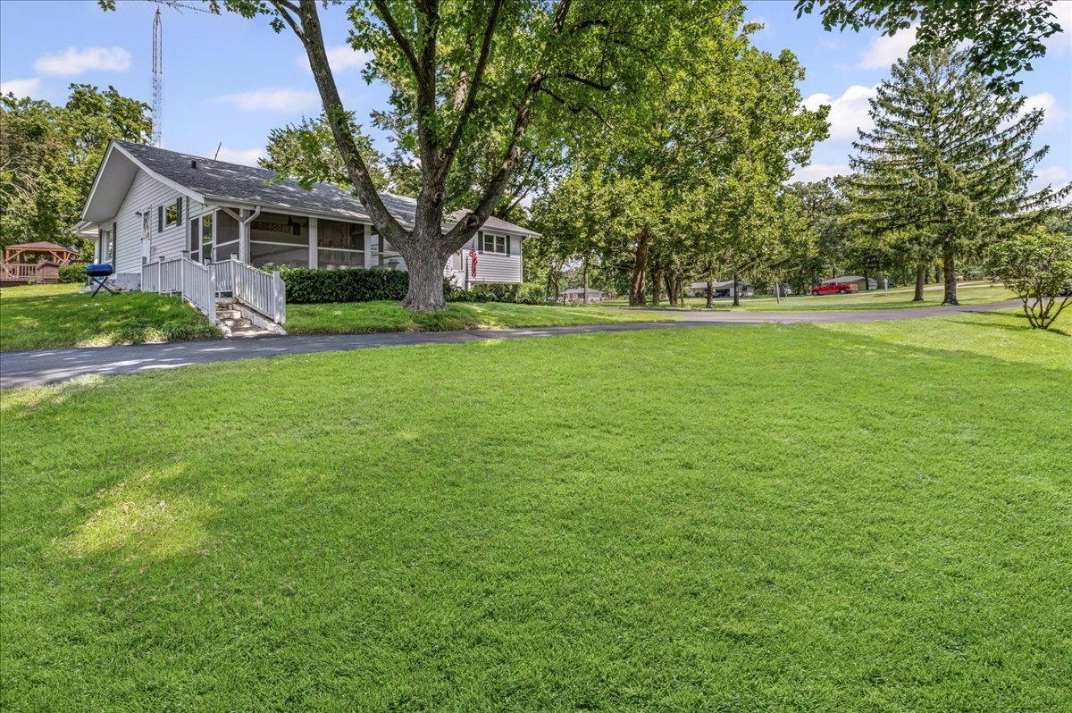 4615 Blue Jay Road Harvard, IL 60033 - Photo 22 of 30 a view of house with a yard