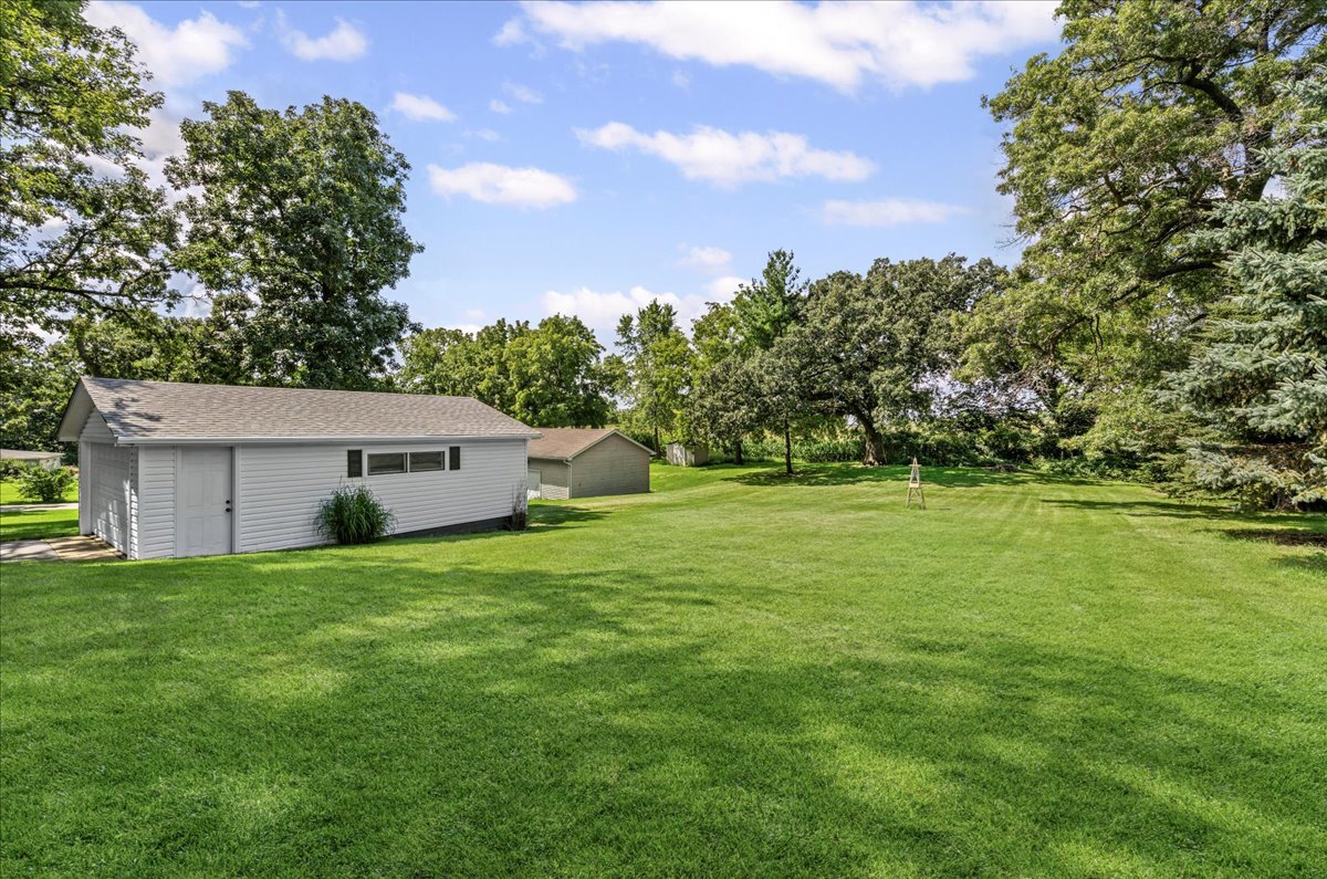 4615 Blue Jay Road Harvard, IL 60033 - Photo 24 of 30 a house with a garden
