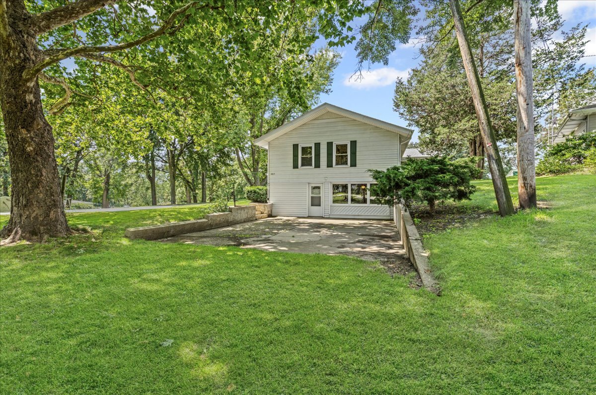 4615 Blue Jay Road Harvard, IL 60033 - Photo 27 of 30 a front view of a house with a yard