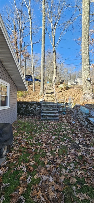 89 Jolicoeur Avenue, Unit 1 Spencer, MA 01562 - Photo 12 of 13 a view of a yard with an outdoor space