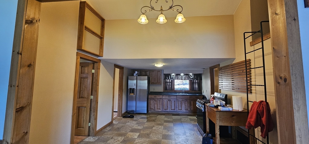 89 Jolicoeur Avenue, Unit 1 Spencer, MA 01562 - Photo 3 of 13 a view of an entryway with a livingroom