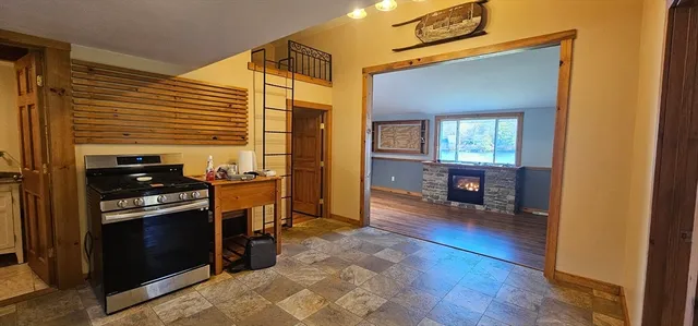a kitchen with sink and refrigerator