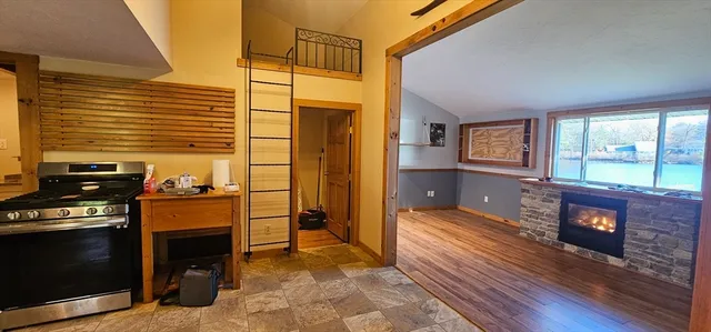 a view of a livingroom with furniture and a fireplace